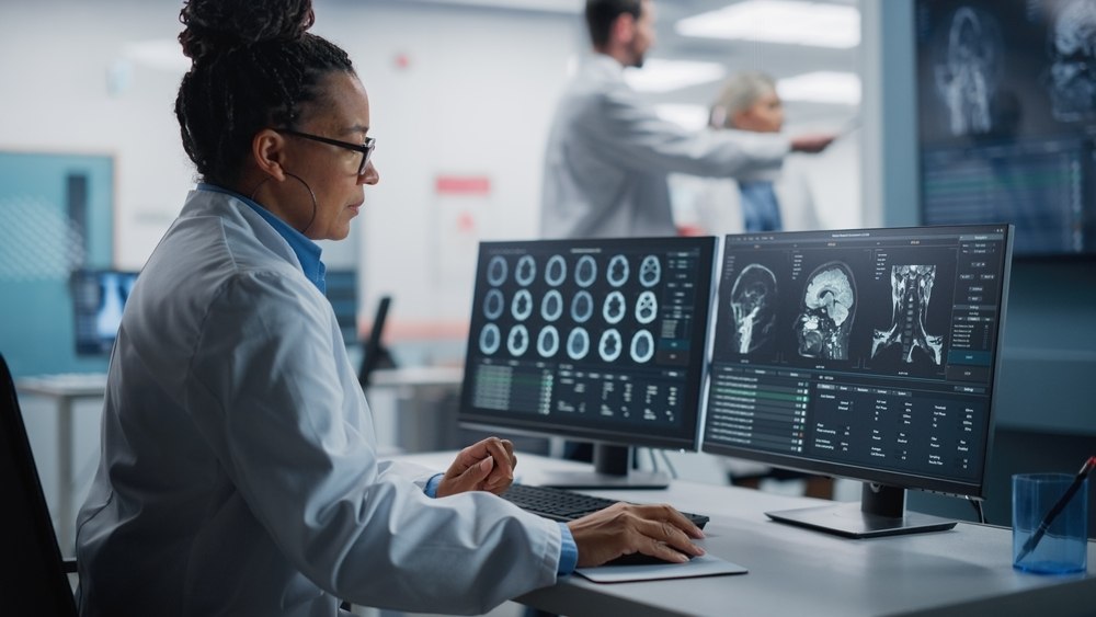 Researcher looking at imaging data on her sceen